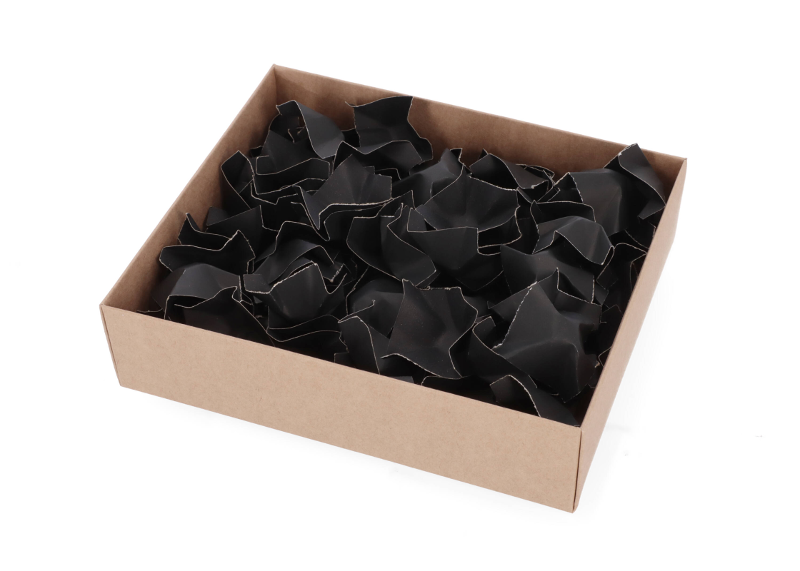 FIL/J: black recycled paper infill in the box 1